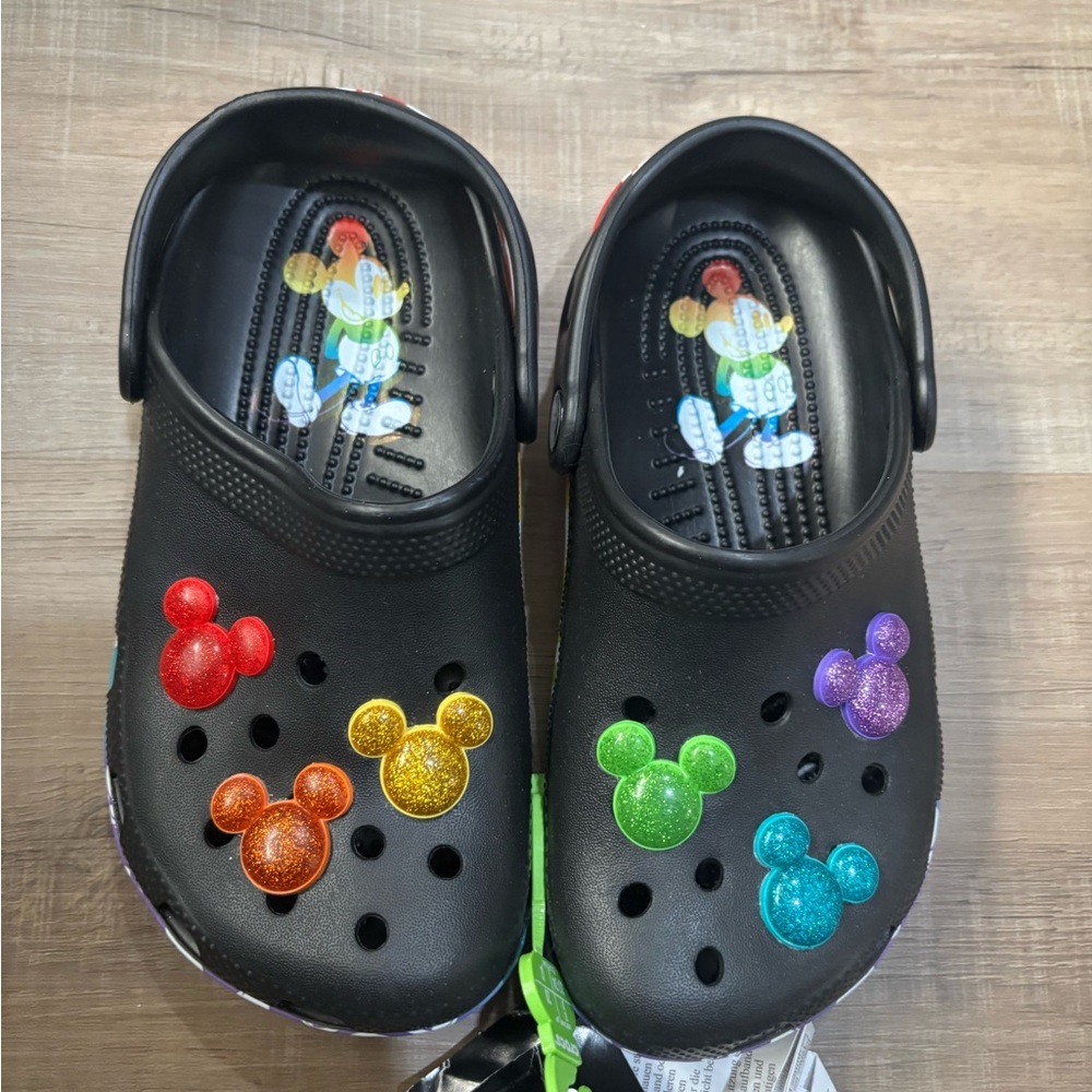 Disney Mickey Mouse Black and Red Crocs with colorfull Mickey head charms .